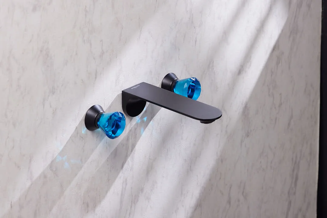 Aquant Statement Wall-Mounted Basin Mixer, Crystal Handles · Matt Black · Blue crystal — Three-hole wall mixer with faceted crystal handles.